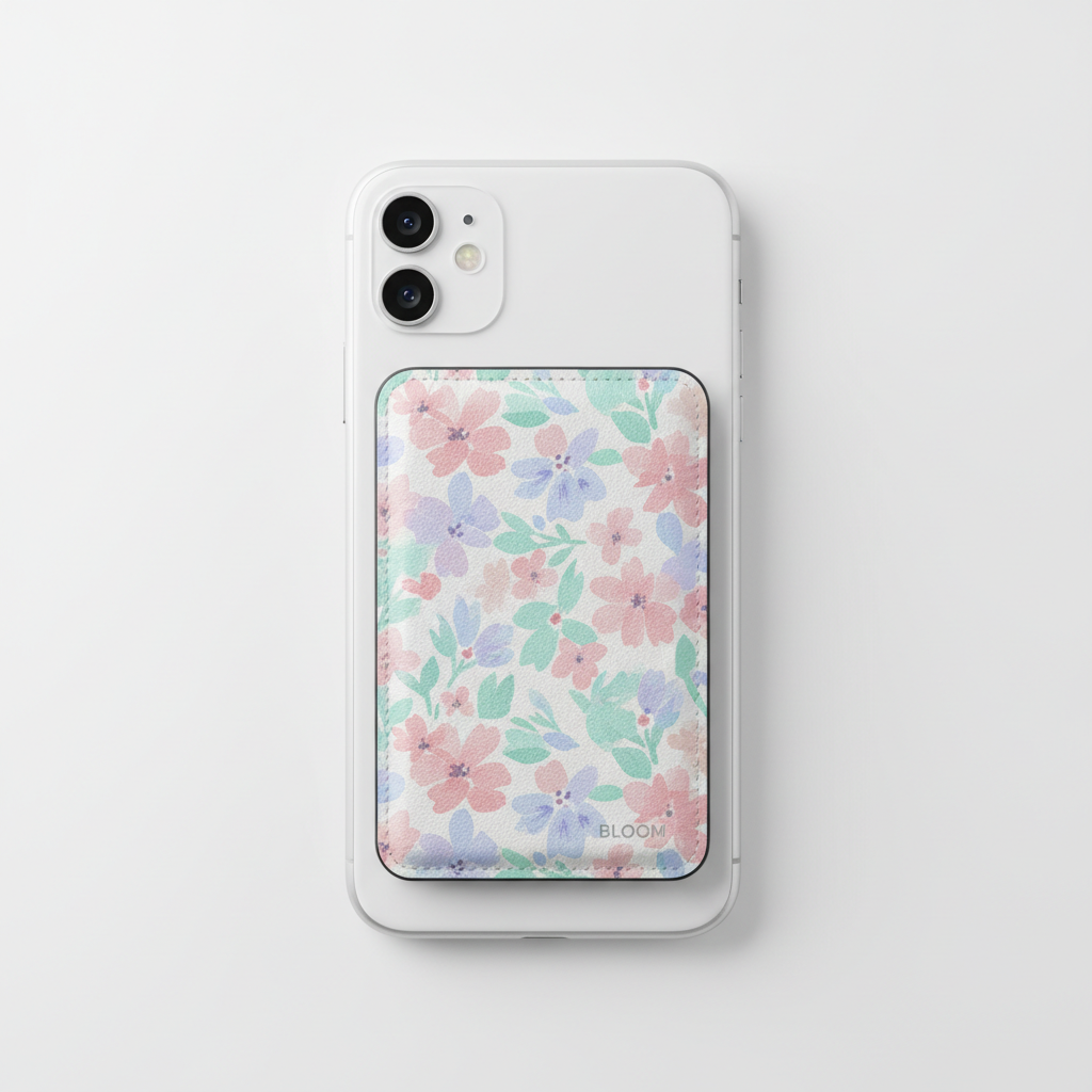 Bloom MagSafe Wallet in floral pastel design attached to iPhone on white background