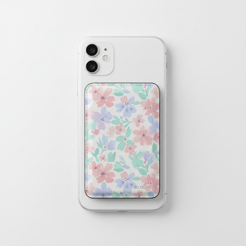 Bloom MagSafe Wallet in floral pastel design attached to iPhone on white background